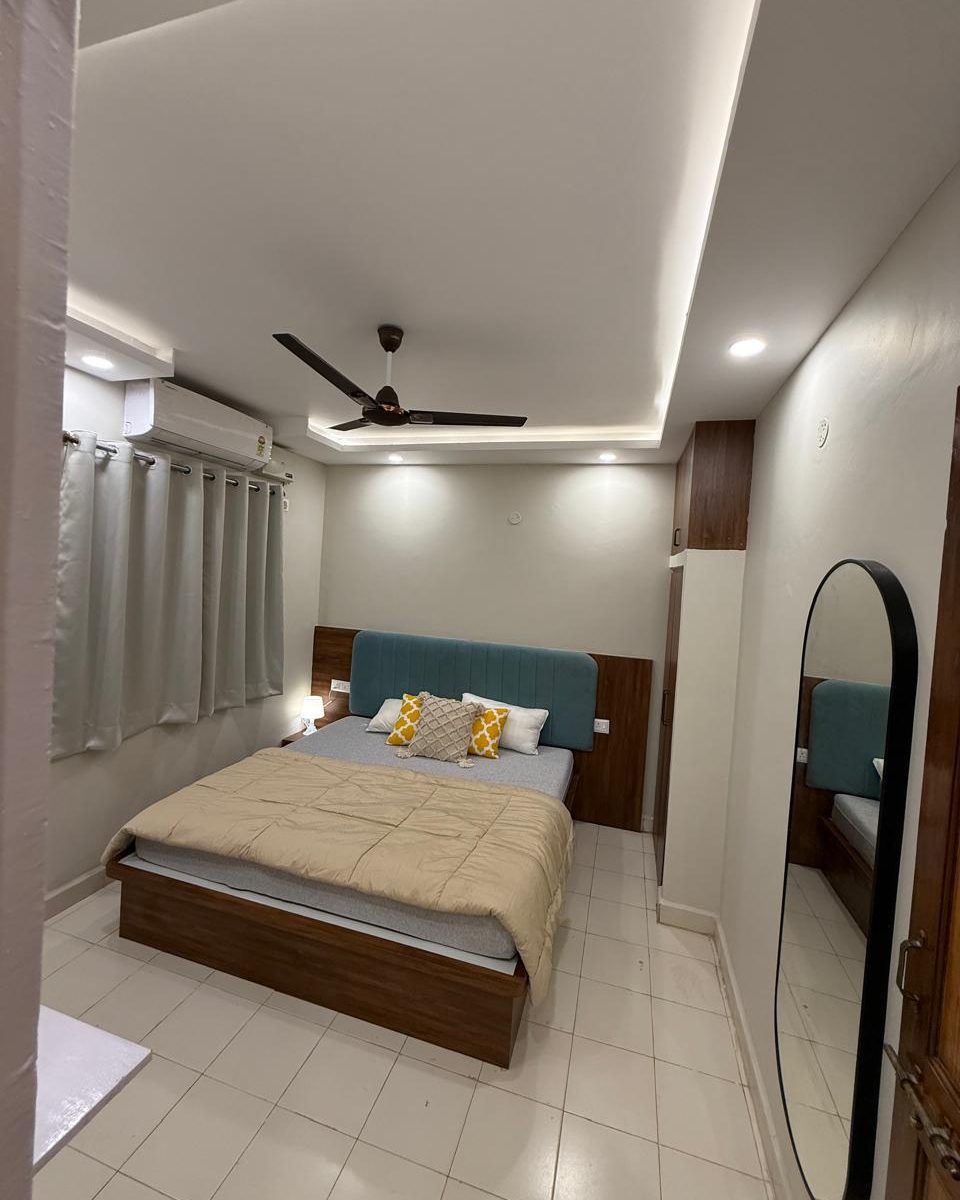 Bedroom with a full length mirror in Hebbal