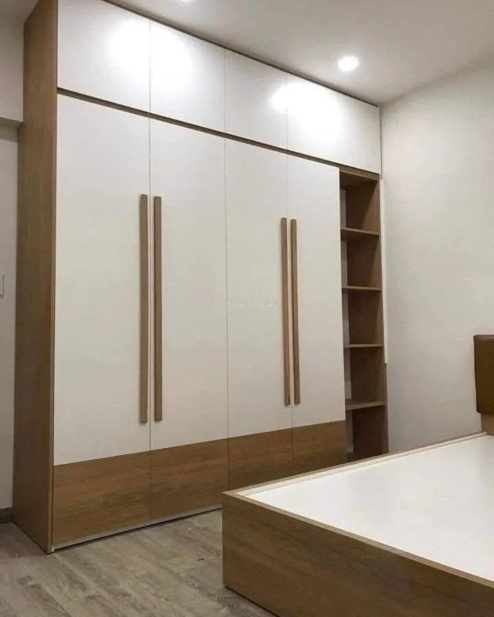 A full height wardrobe in white and wood